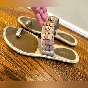 Women’s Cole Haan gold, pewter, flat shell sandals size 9